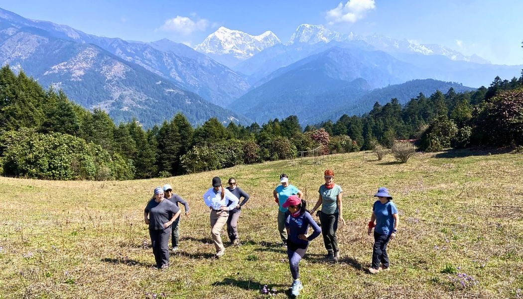 Group warm up dance with Everest views in background-1