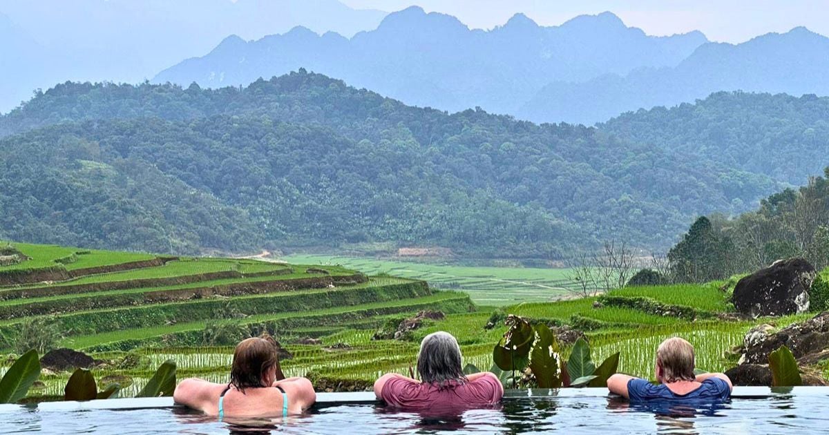 Looking at rice fields and hills in rural Vietnam from the pool