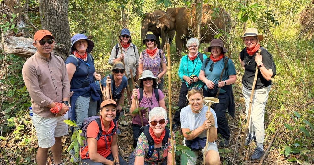 Adventurous Women tour group in Cambodian jungle with elephants