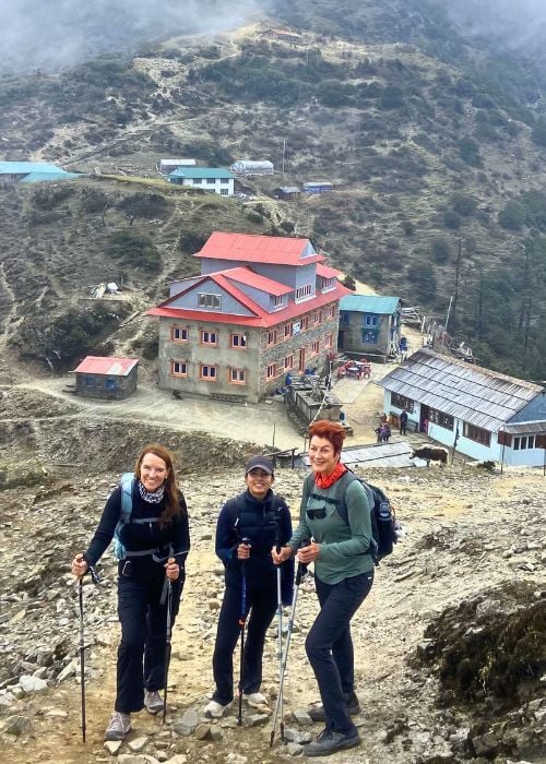 Smiling while trekking up a steep climb