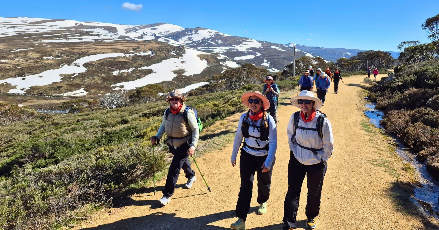 Snowy mountain s ladies group hiking