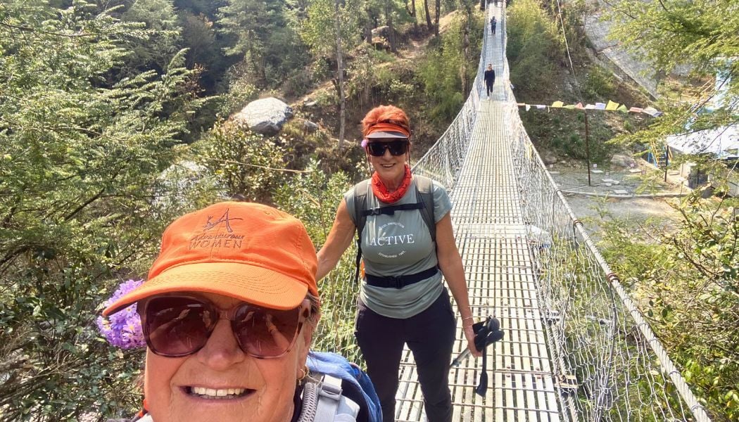 Walking over a suspension bridge in the Himalayas Nepal-1