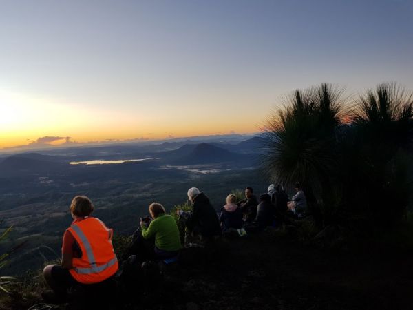 Women watching the sun about to rise on Mt Cordeaux