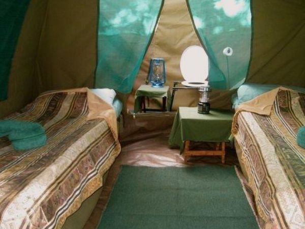 Tent interior with toilet and shower