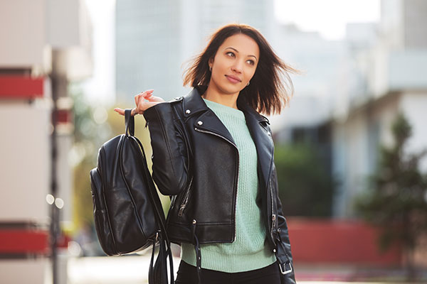 Woman with leather backpack