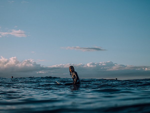 Woman in the surf - Photo by Tim Marshall on Unsplash
